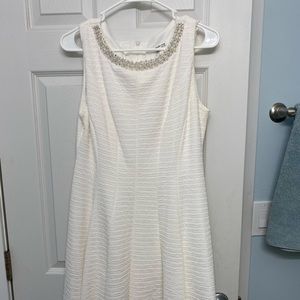 White dress with embellished neckline